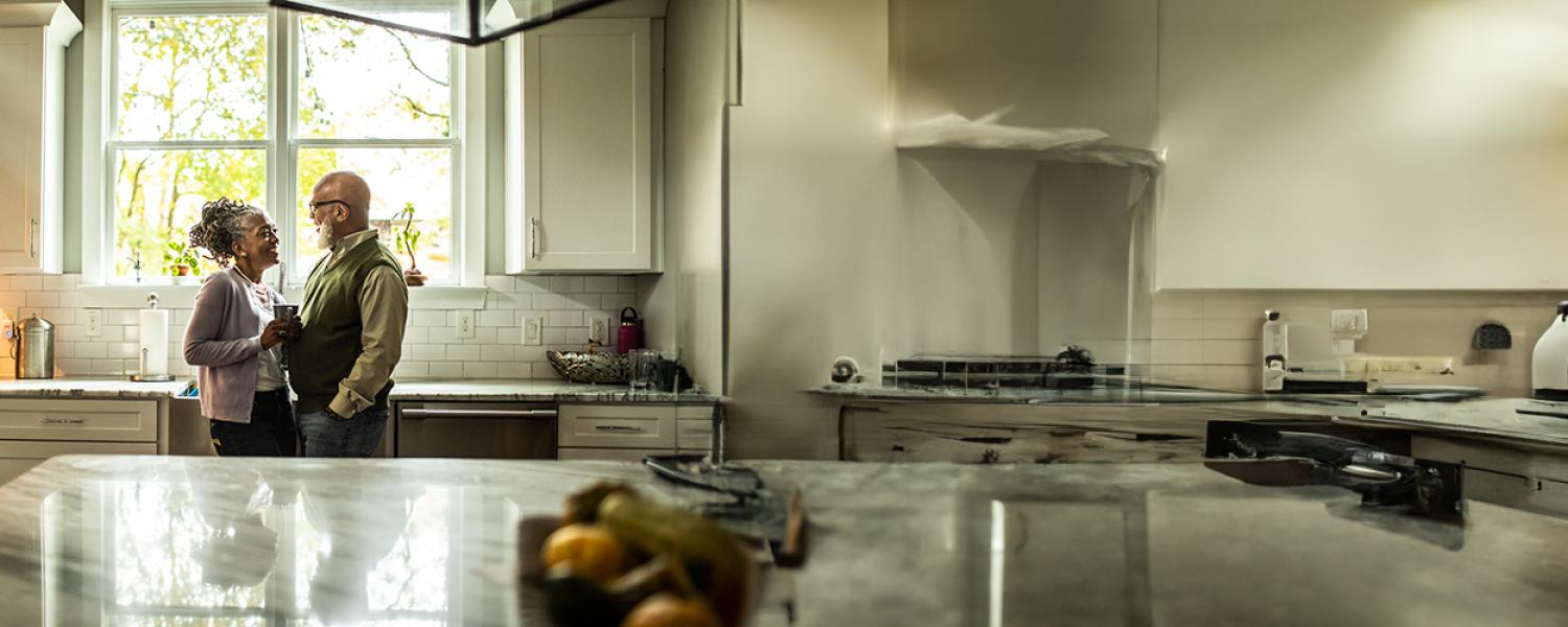 Couple dancing in kitchen. Sandy Spring Bank.